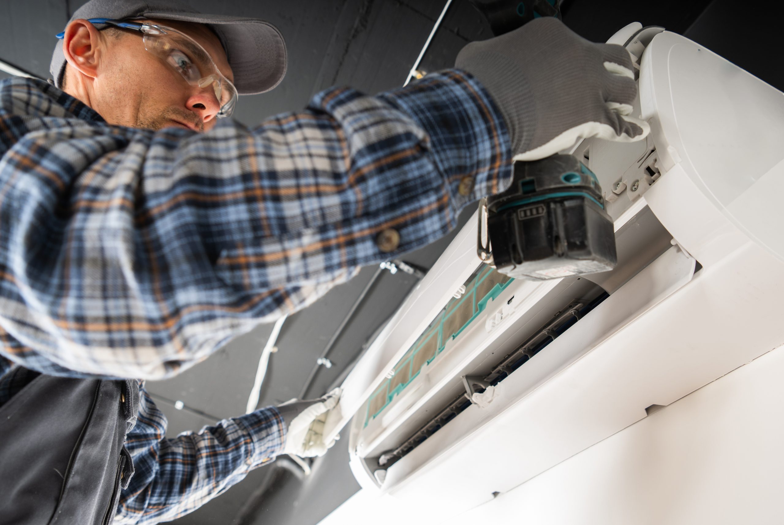 Technician checking AC system performance