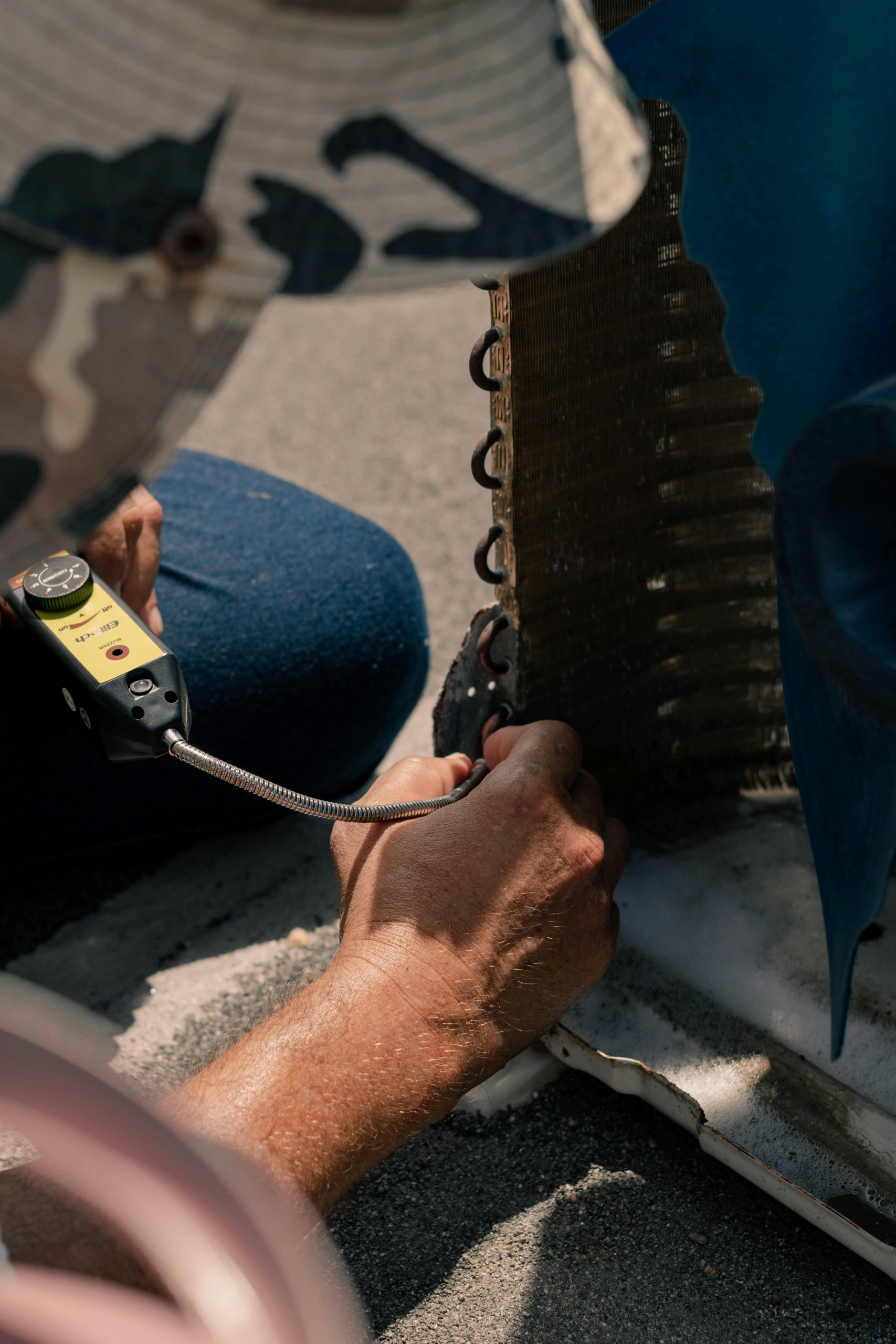 Technician cleaning AC coils for better airflow