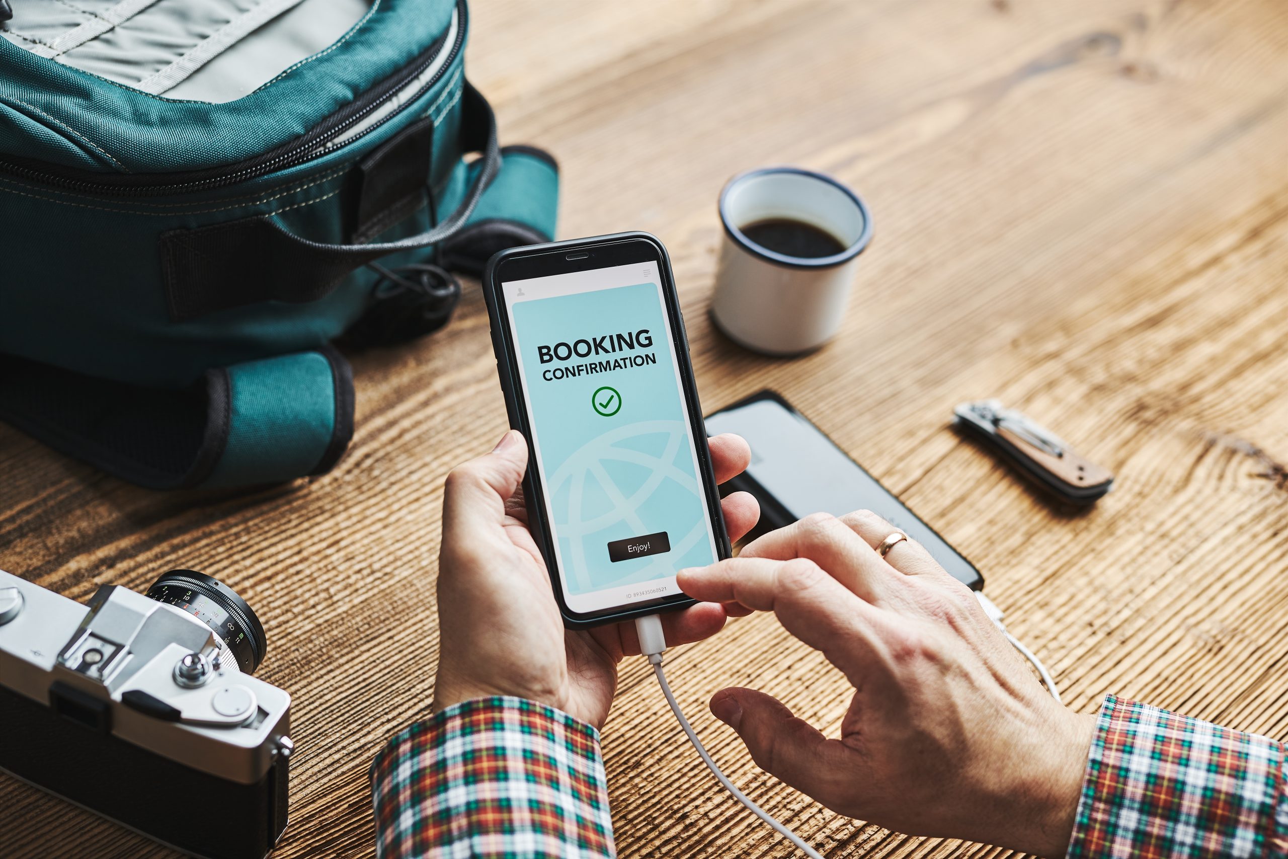 Dubai resident booking AC coil cleaning service on smartphone with transparent upfront pricing for stress-free scheduling.
