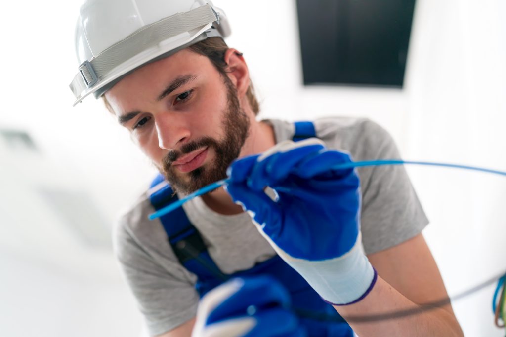 Electrician performing lighting installation in Sharjah.