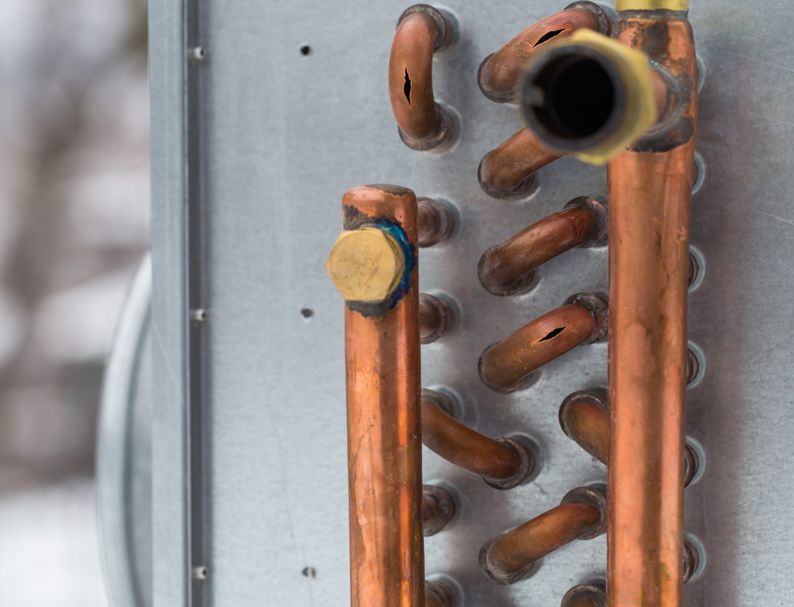 AC maintenance Abu Dhabi deep cleaning of condenser coil for improved cooling.