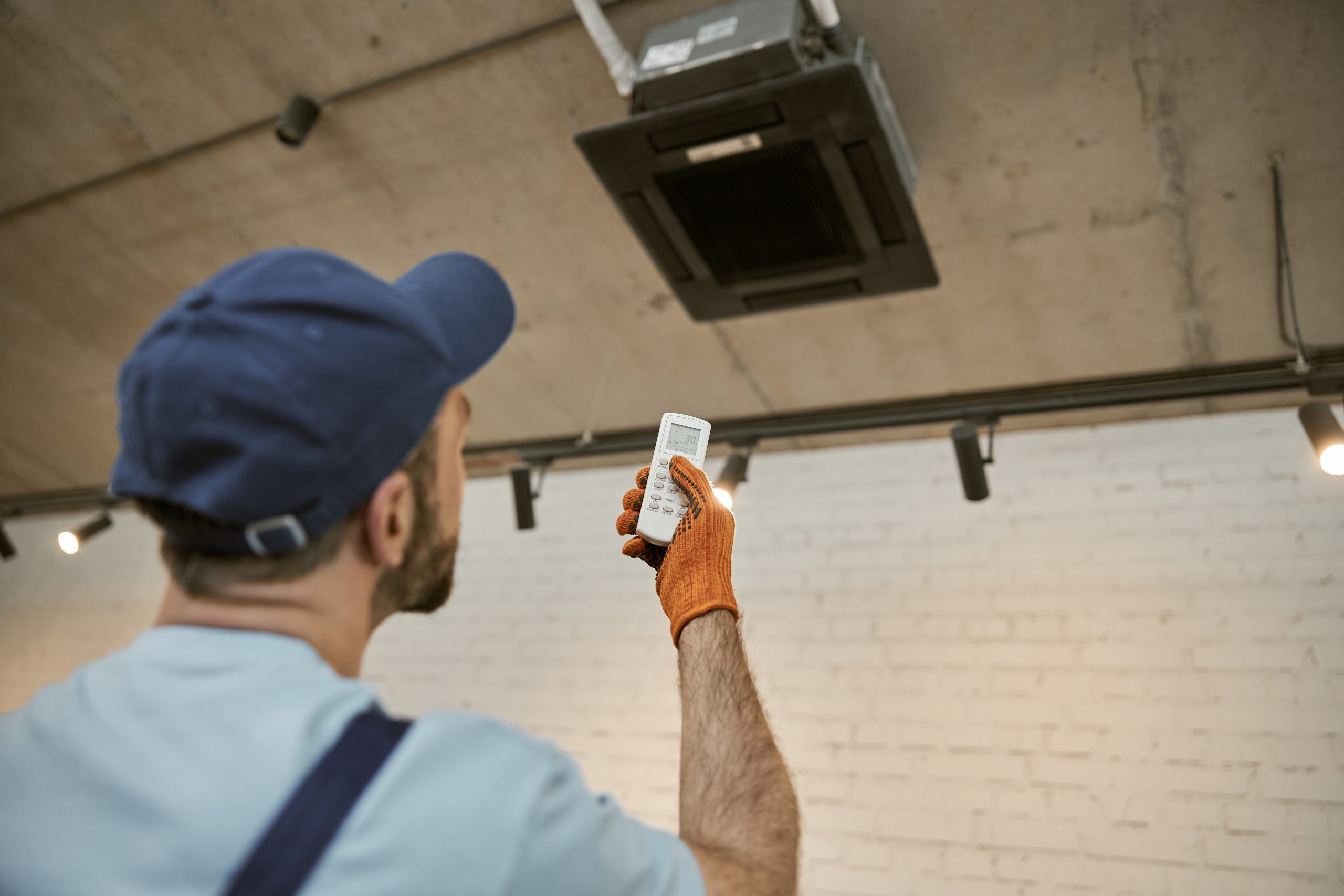 Licensed AC cleaning Sharjah technician inspecting ducts with camera for air quality check.