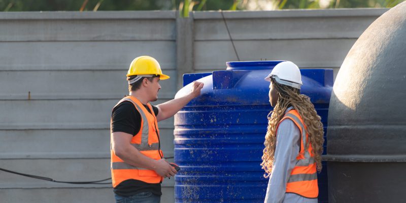 Water Tank Cleaning in UAE Technician cleaning underground water tank