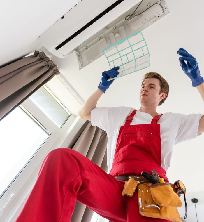 technician service checking and repairing air conditioner indoors technician service checking and repairing air conditioner indoors.