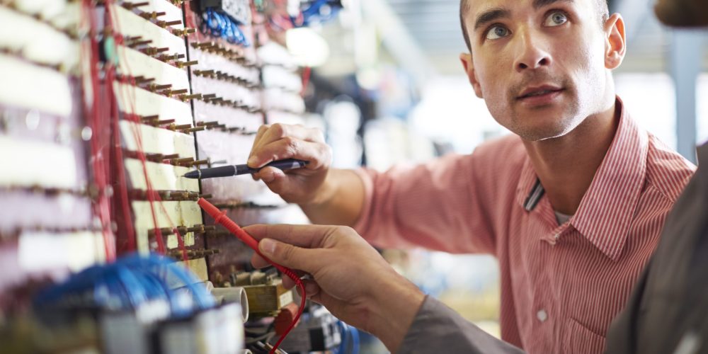 Emergency electrician in Abu Dhabi completing service call.